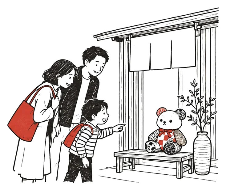 店先に飾られたくみぐまを親子が見つける絵